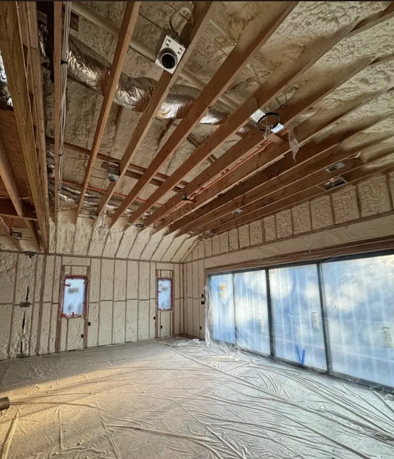 Interior walls and ceiling insulated with spray foam during new construction in Barnesville